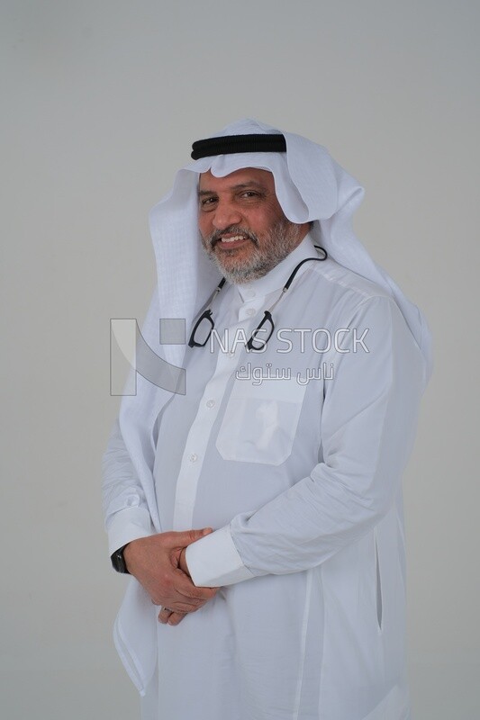 close-up of a Saudi man in traditional Saudi dress, Saudi model, white background