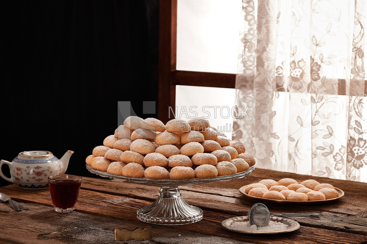 Kahk Al-Eid with tea , Eid Al-Fitr cookies