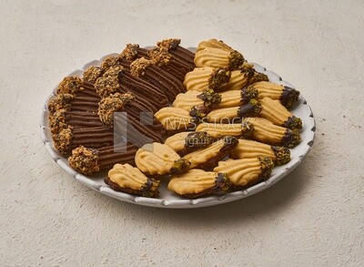 Petit four sweets on a solid background