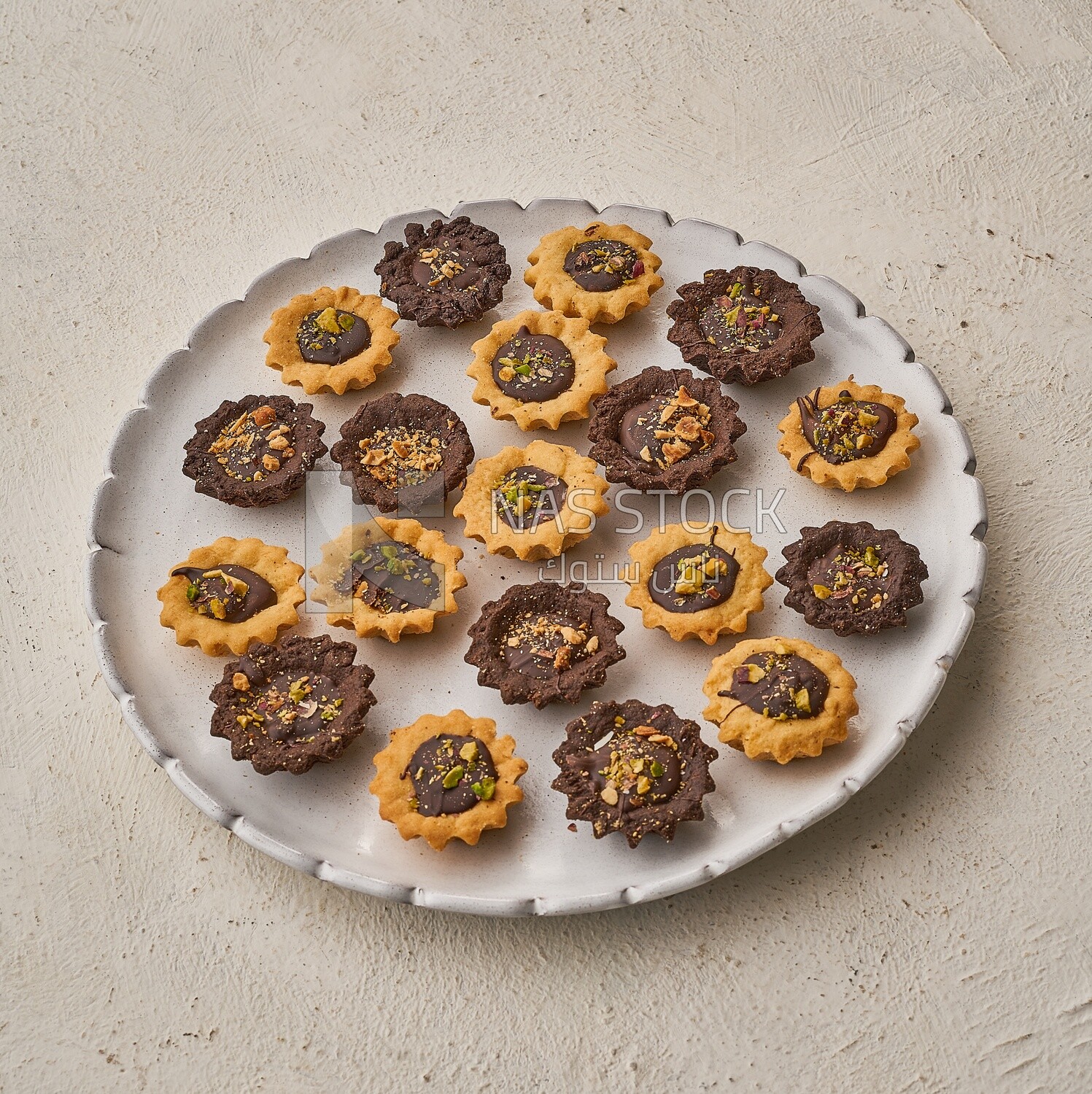 Petit four sweets on a solid background ,Side view