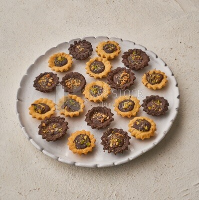 Petit four sweets on a solid background ,Side view