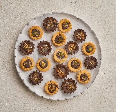 Petit four sweets on a solid background , top view