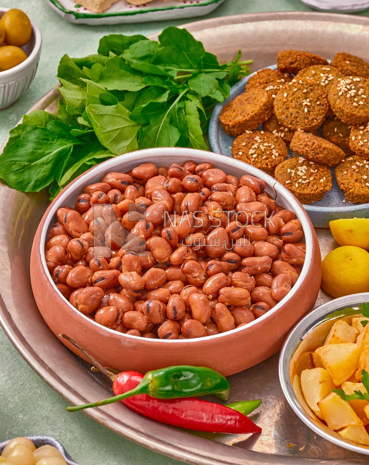 Close-up of oriental breakfast, a dish of foul medames, falafel tablets, Arabic breakfast, arab restaurant