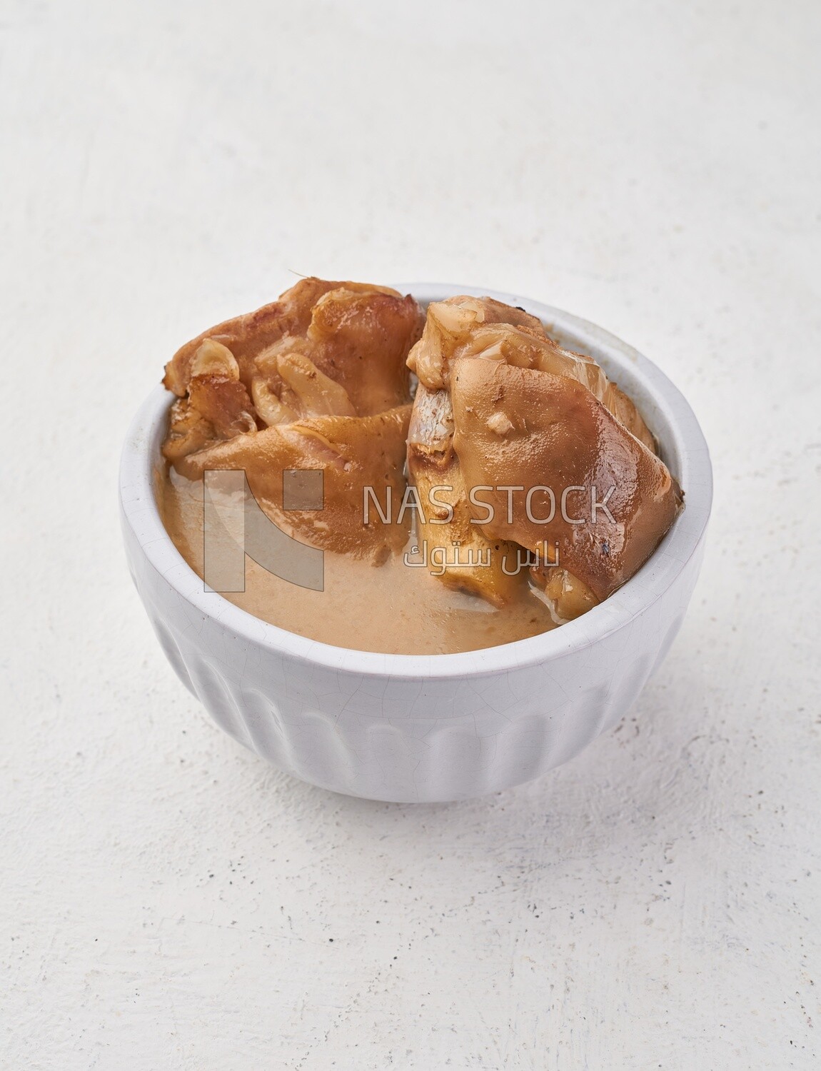 Bowl of trotters soup, casserole of delicious trotter soup, Arabic meals, trotter soup