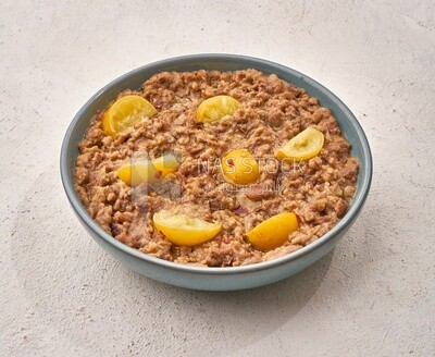 Close-up of oriental breakfast, a dish of foul medames with lemon slices, Arabic breakfast, arab restaurant