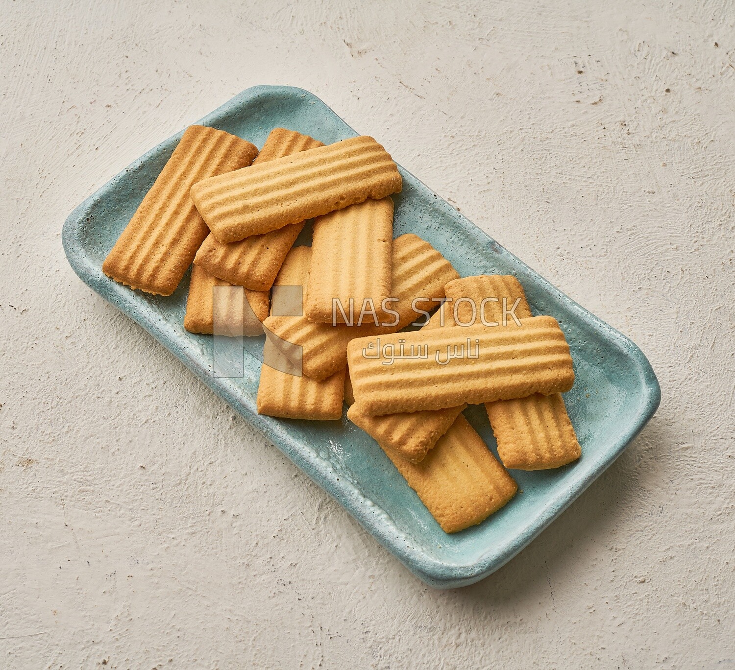 Plate of biscuits on an isolated background, top view