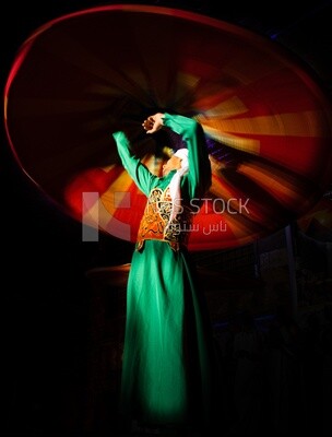 A man dances with a skirt, which is one of the Egyptian folk arts, Egyptian folklore