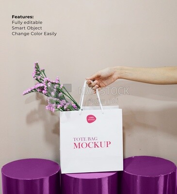 Mockup for woman holding paper bag with flowers