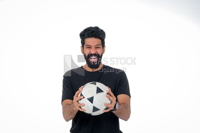 Saudi man holding a ball, playing football,  practicing soccer sports, playing with the ball, white background, Saudi model