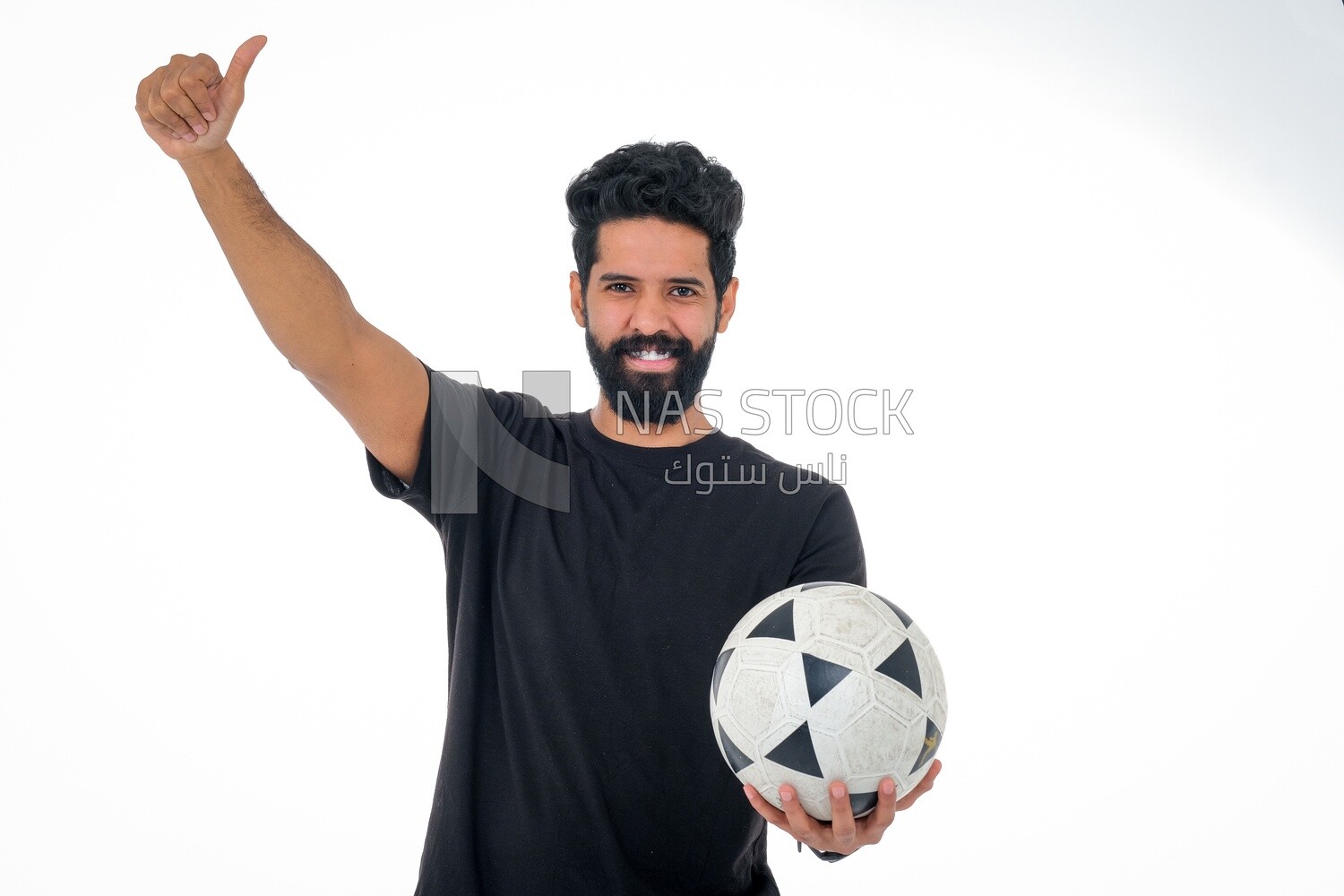 Saudi man holding a ball, playing football,  practicing soccer sports, playing with the ball, white background, Saudi model