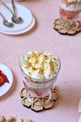 Top view of a cup of Kunafa with strawberries and cream