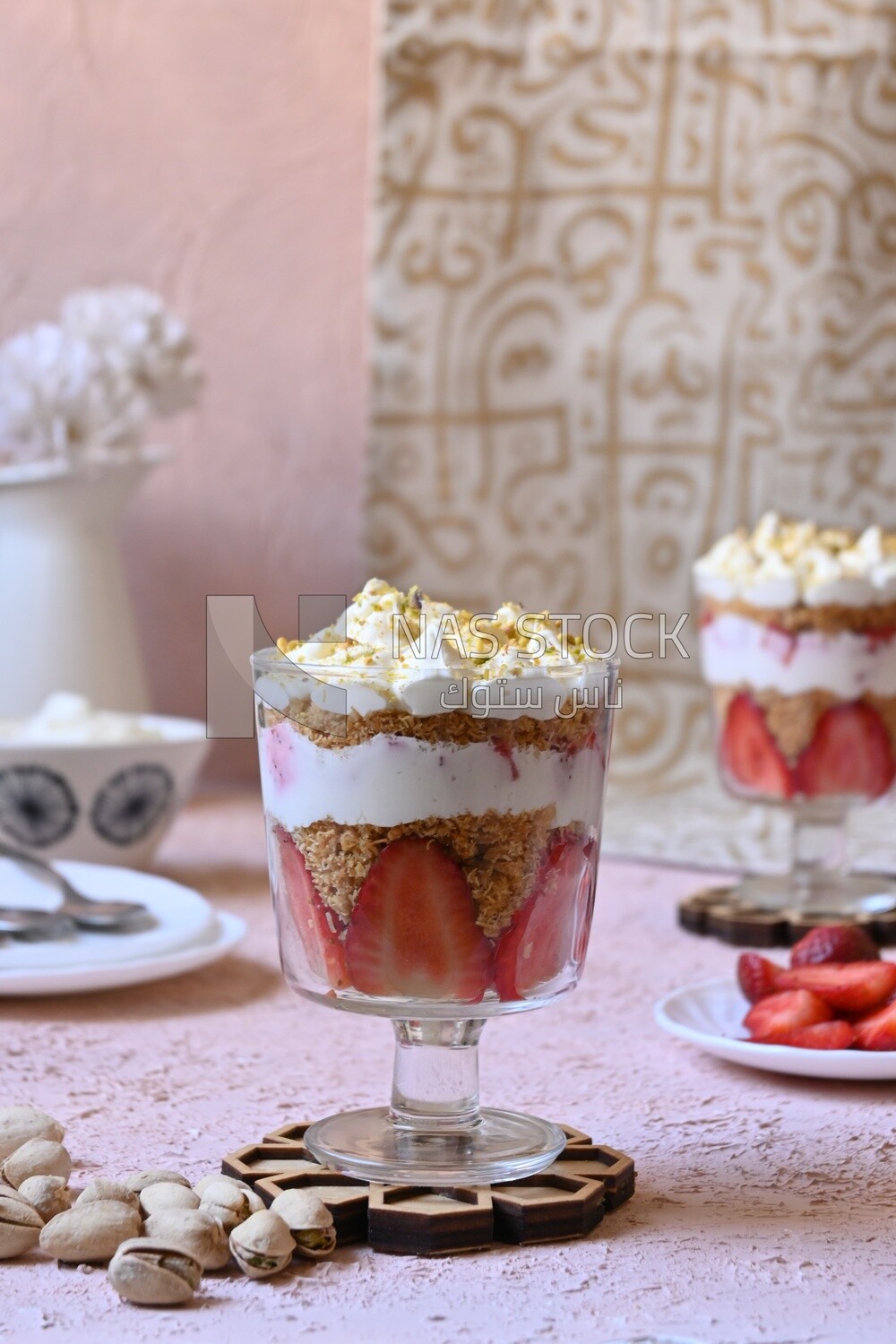 Side view of a cup of kunafa with strawberries