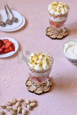 Cup of Kunafa with strawberries and cream