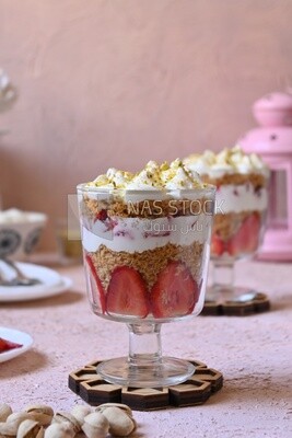 cup of kunafa with strawberries and cream