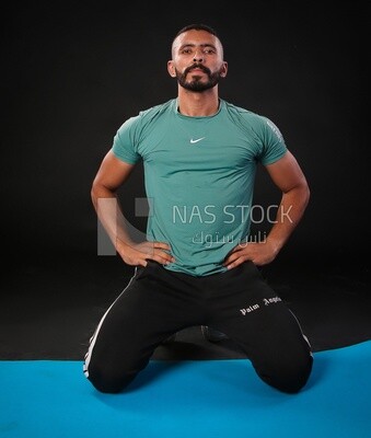 A man training on a black background