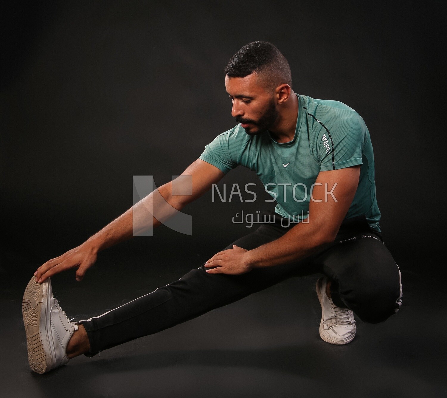 Man training on a black background