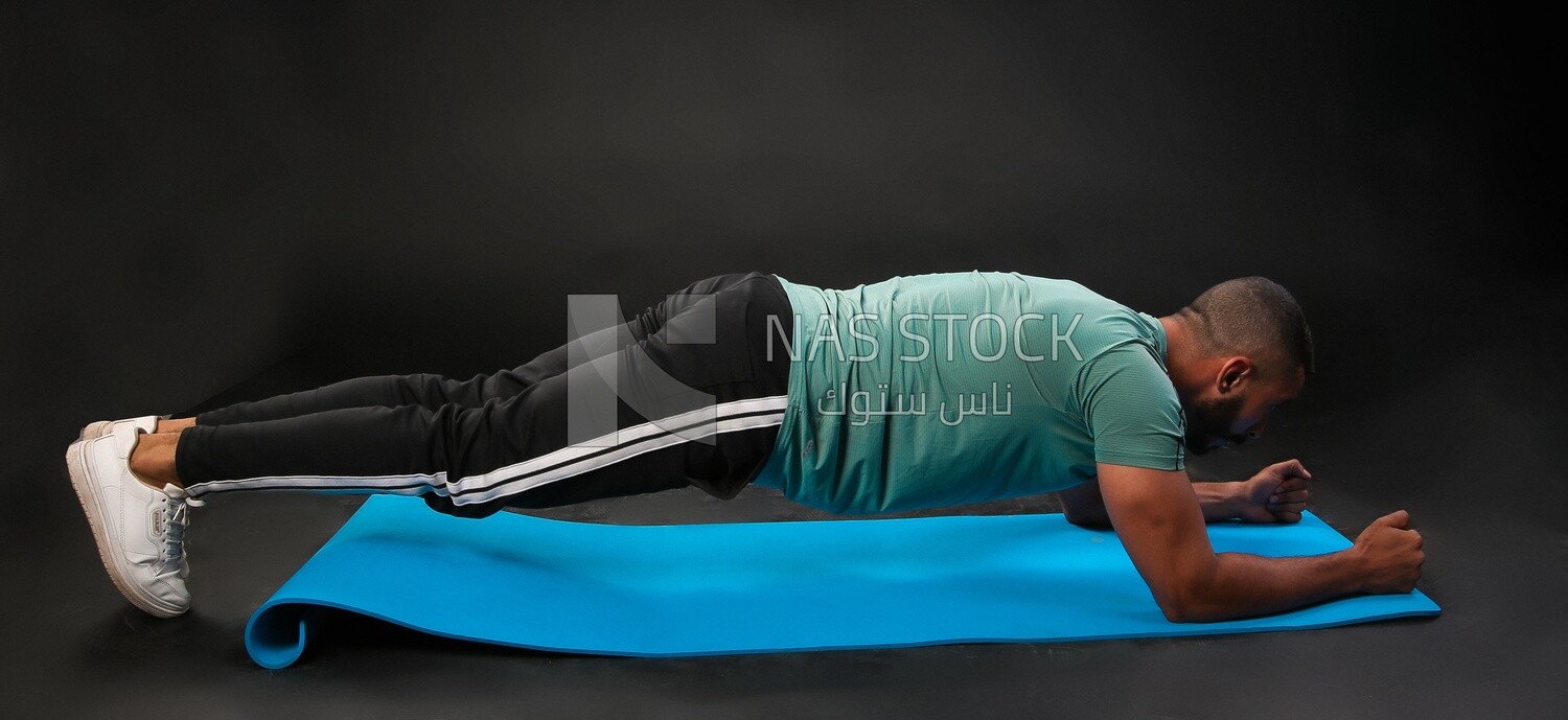 A man training on a black background