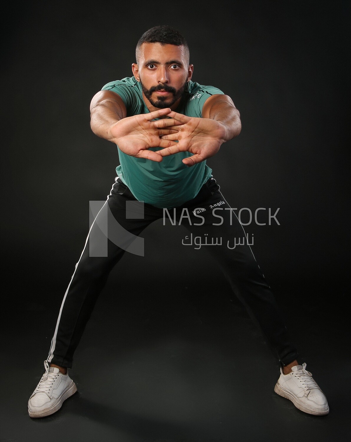 A man training on a black background