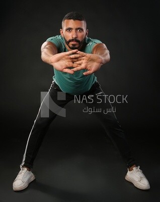 A man training on a black background