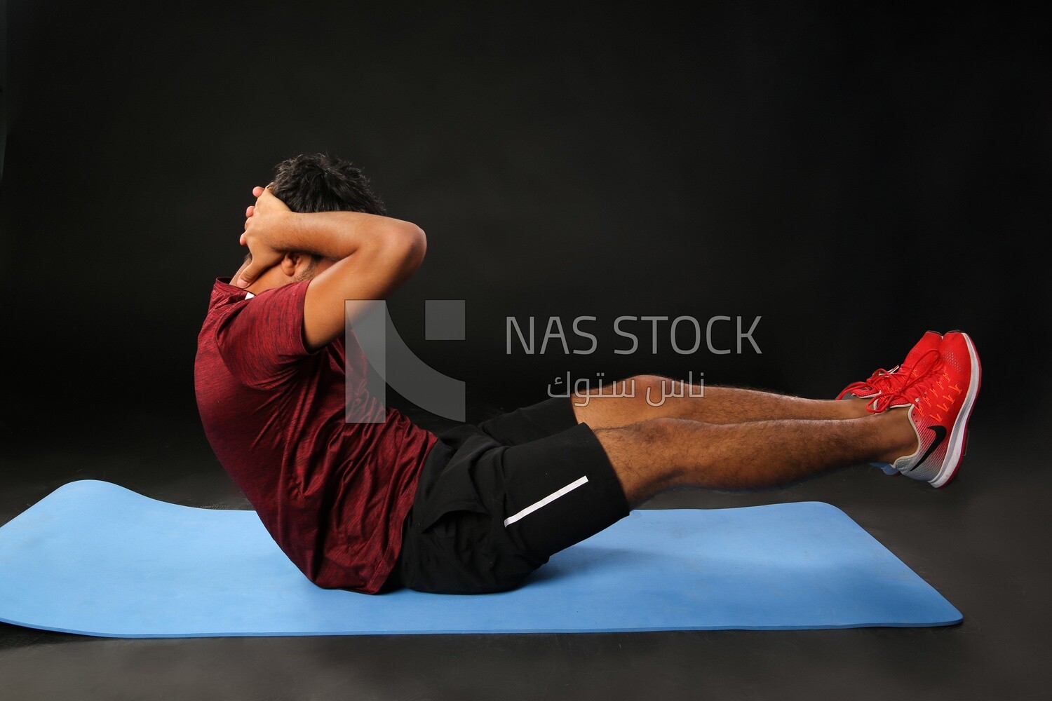 A man training on a black background