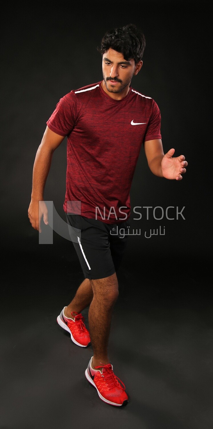 A man running on a black background