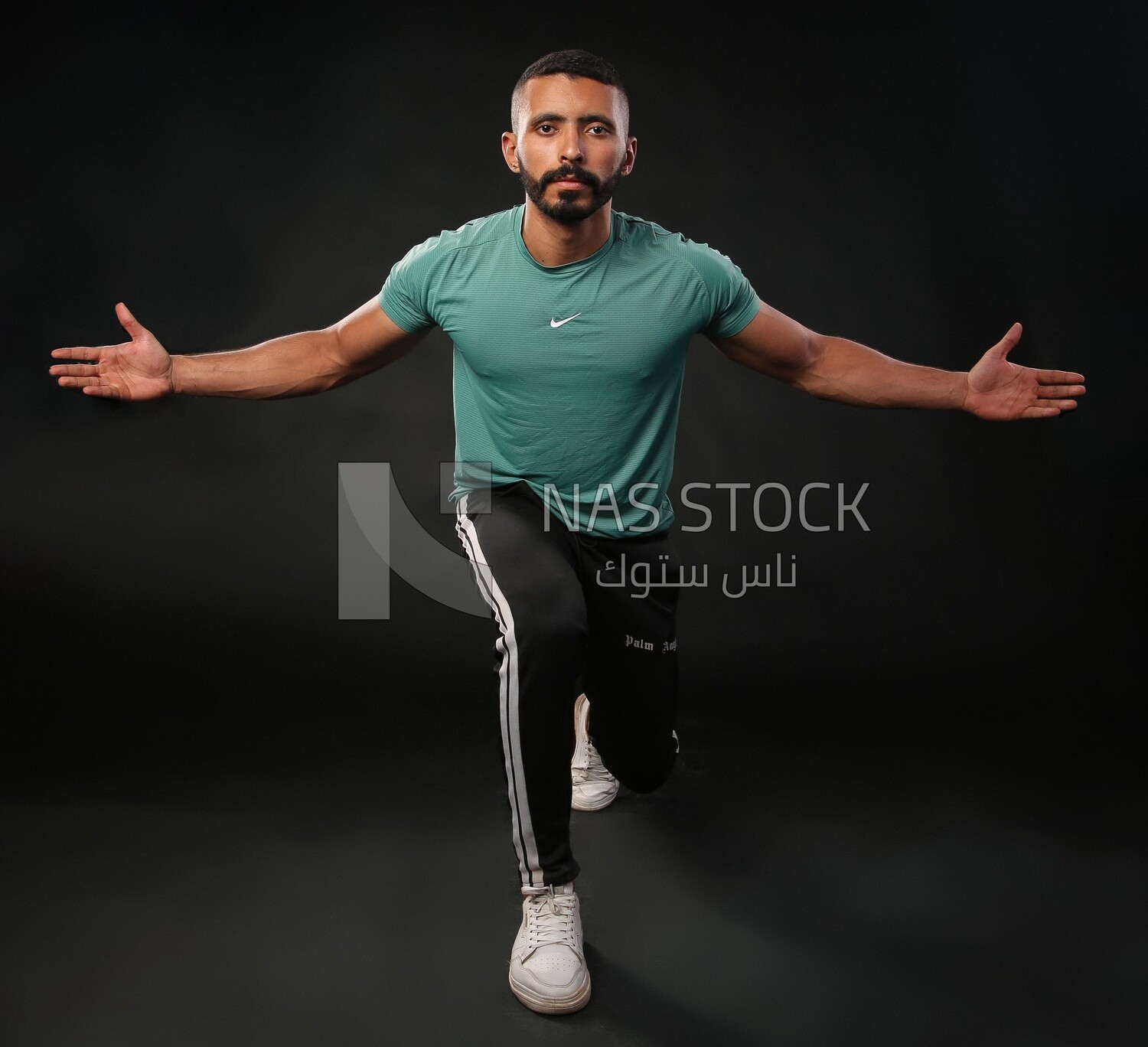 A man training on a black background