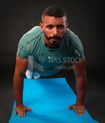 A man training on a black background