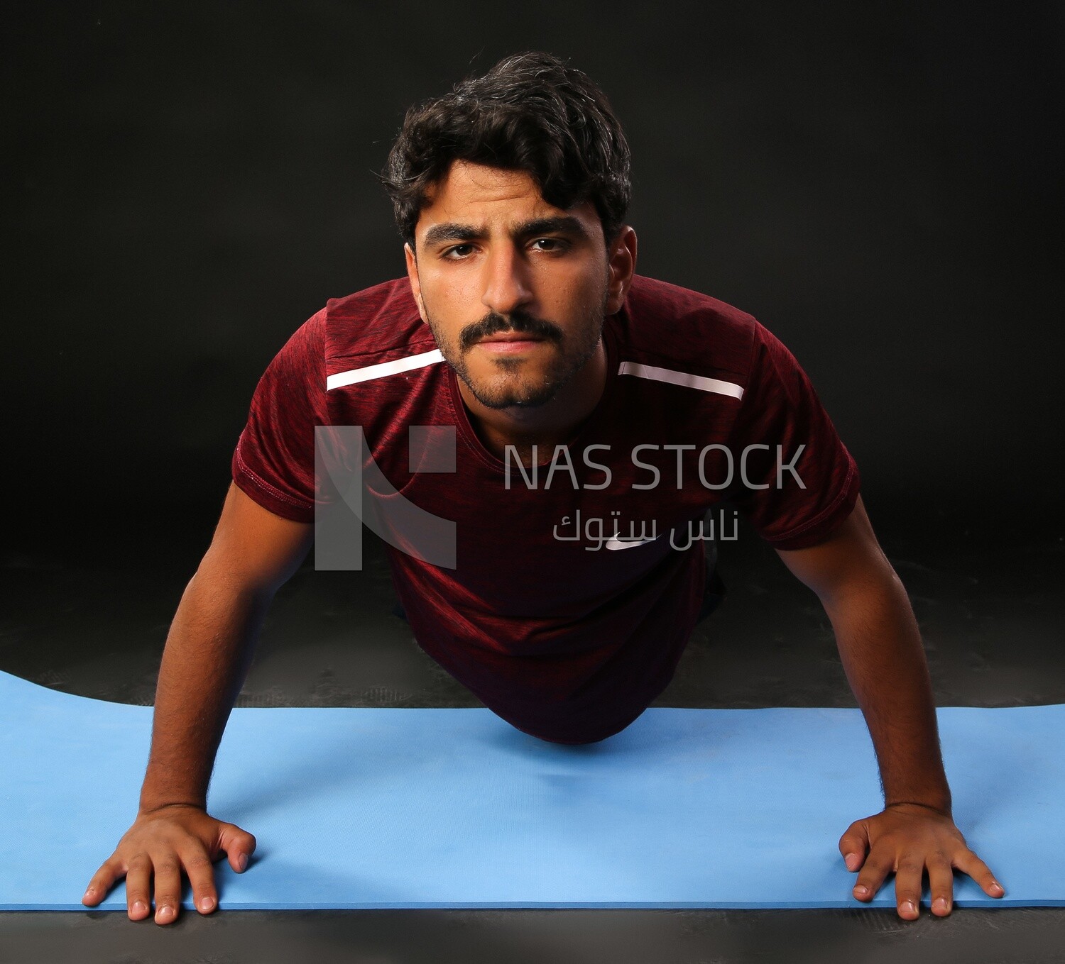 A man training on a black background