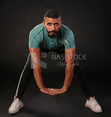 A man training on a black background