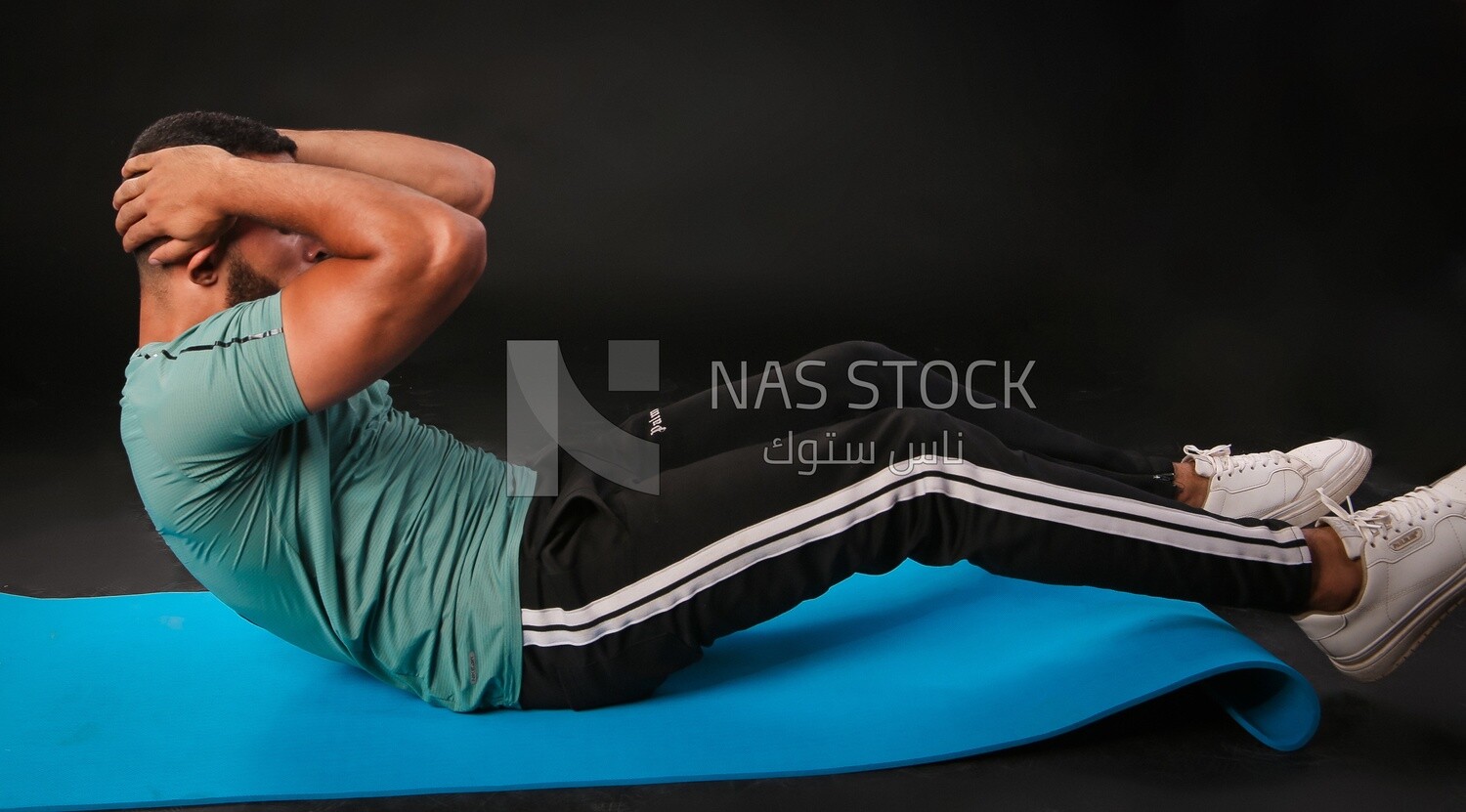 A man training on a black background