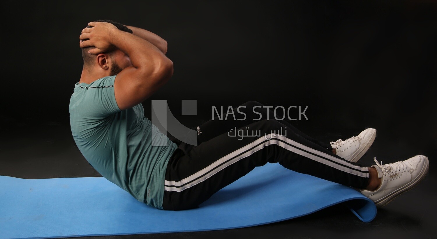 A man training on a black background