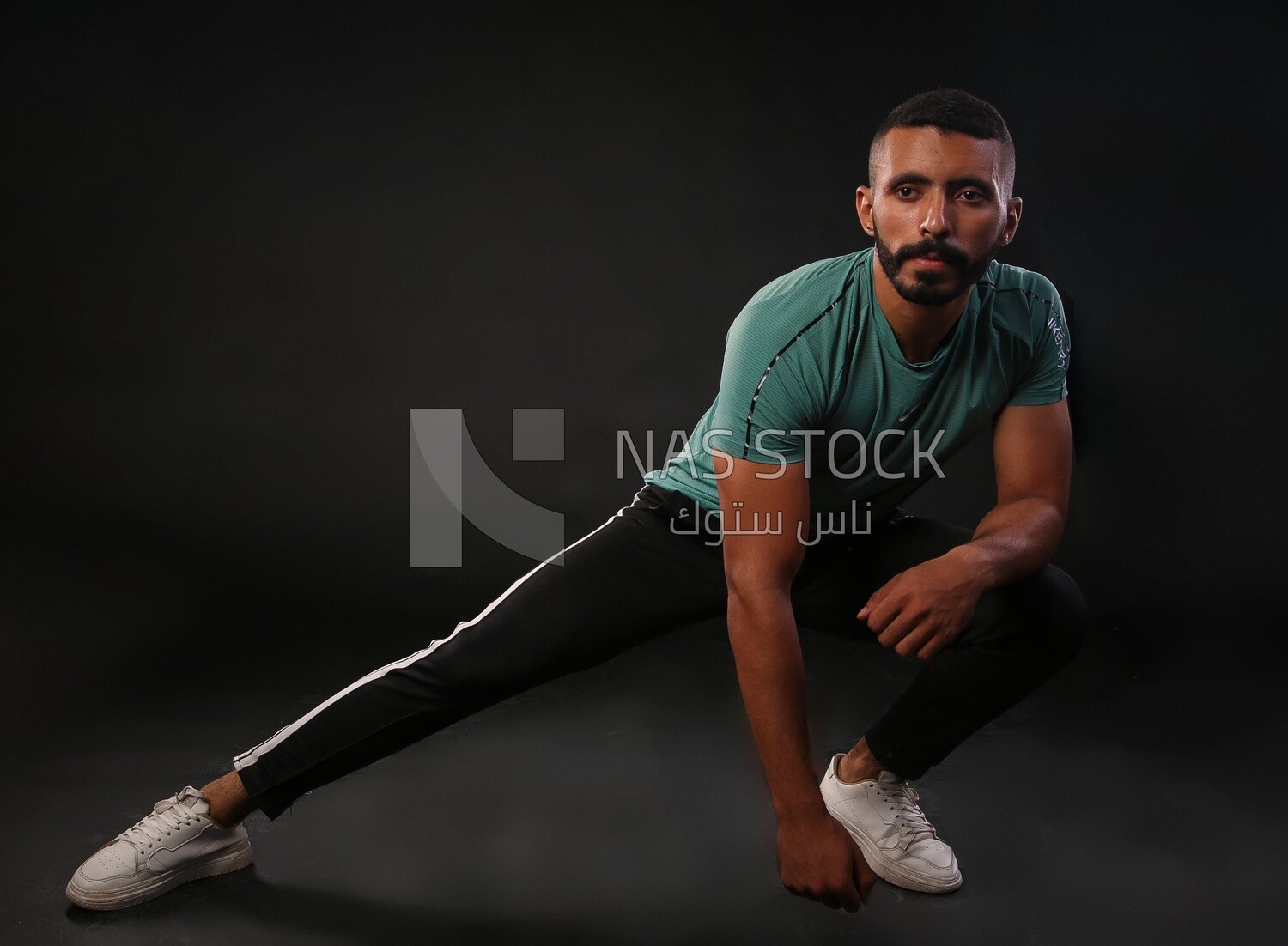 A man training on a black background