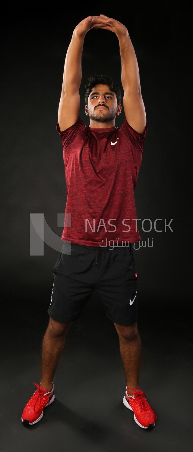 A man training on a black background