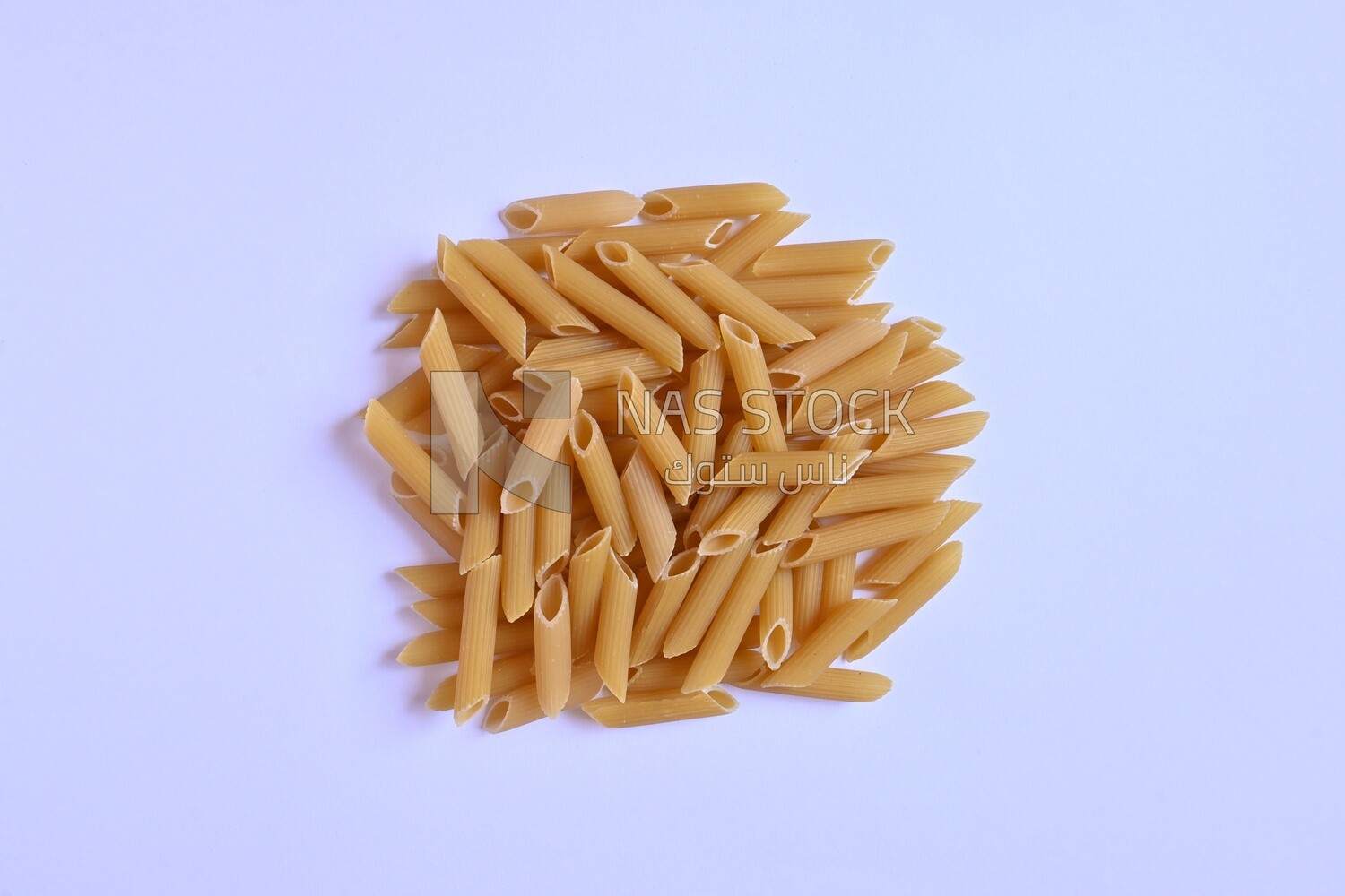 Group of  Uncooked Penne Pasta ,One of the types of pasta