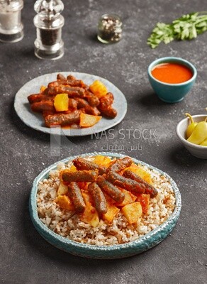 Rice and a plate of rice kofta with potatoes