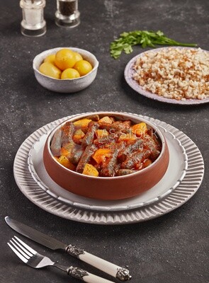 Dining table with rice and a plate of rice kofta