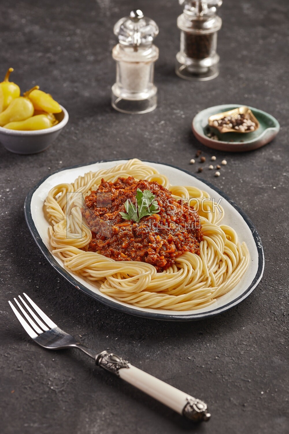 Dining table with spaghetti with minced meat