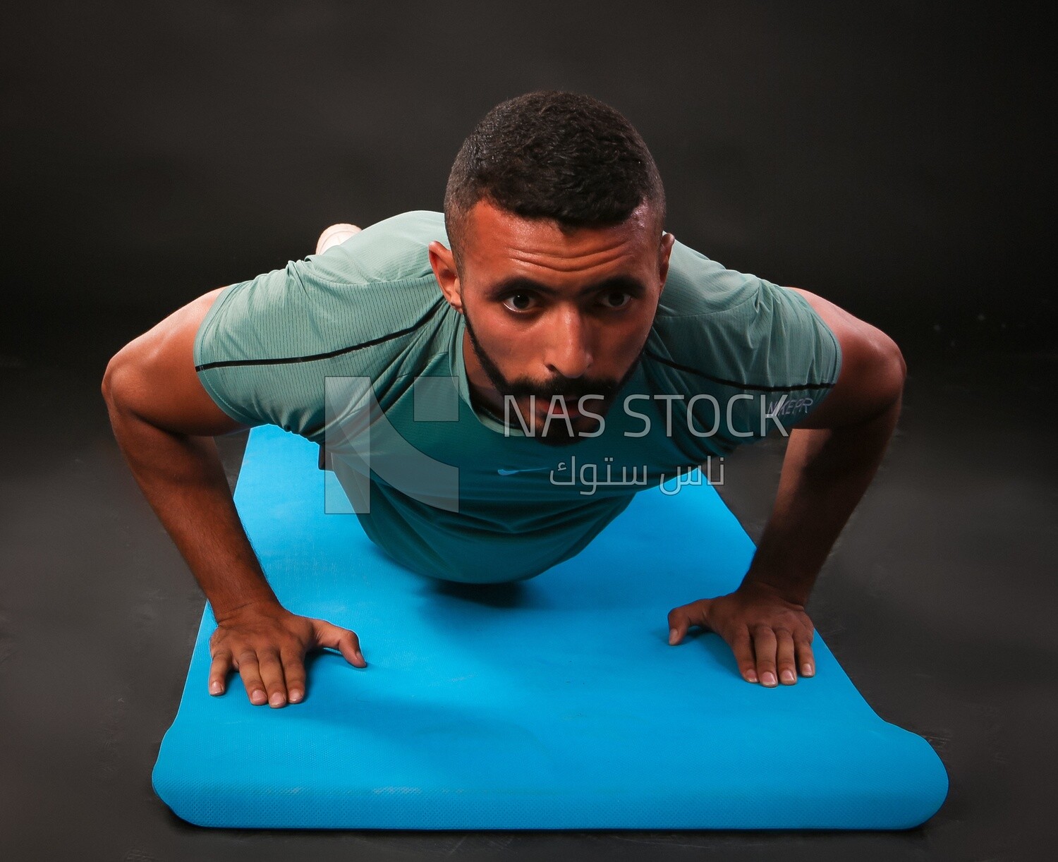 A man training on a black background