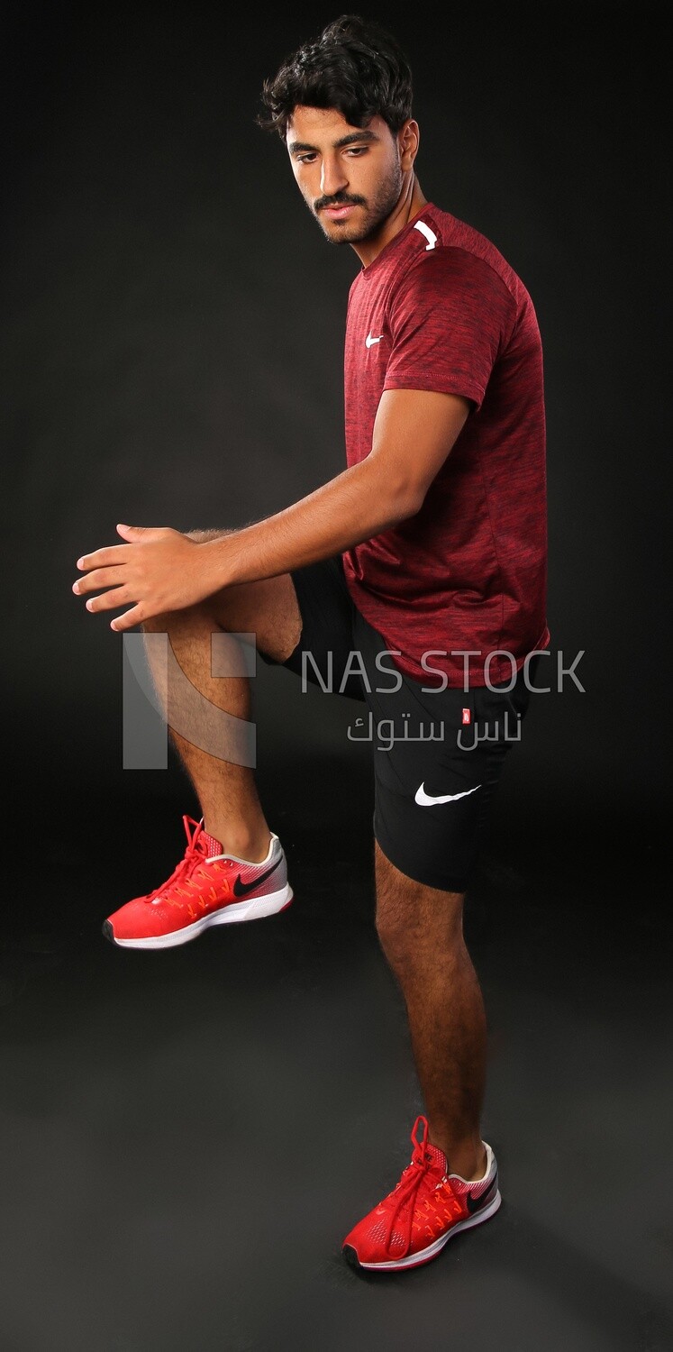 A man training on a black background