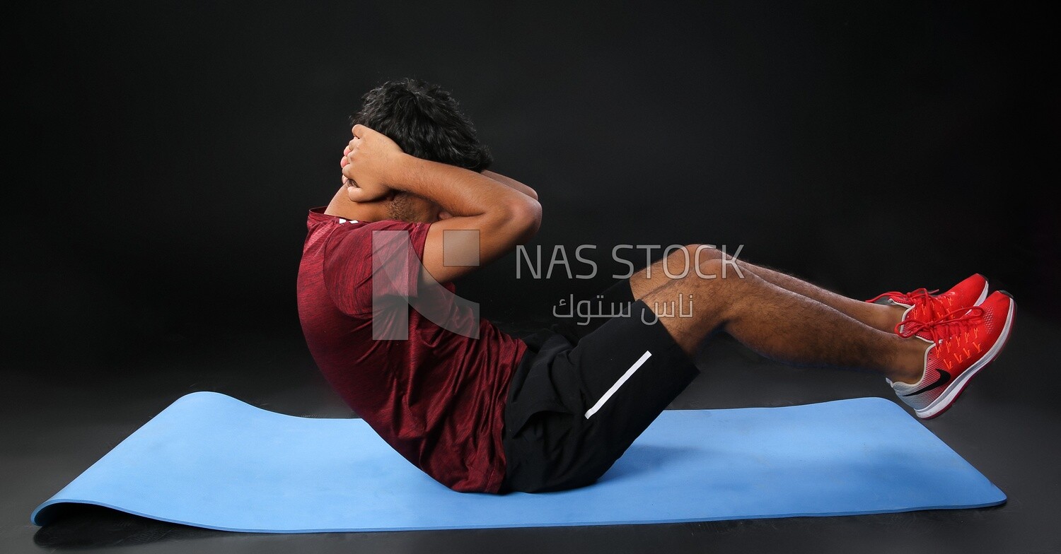 A man training on a black background