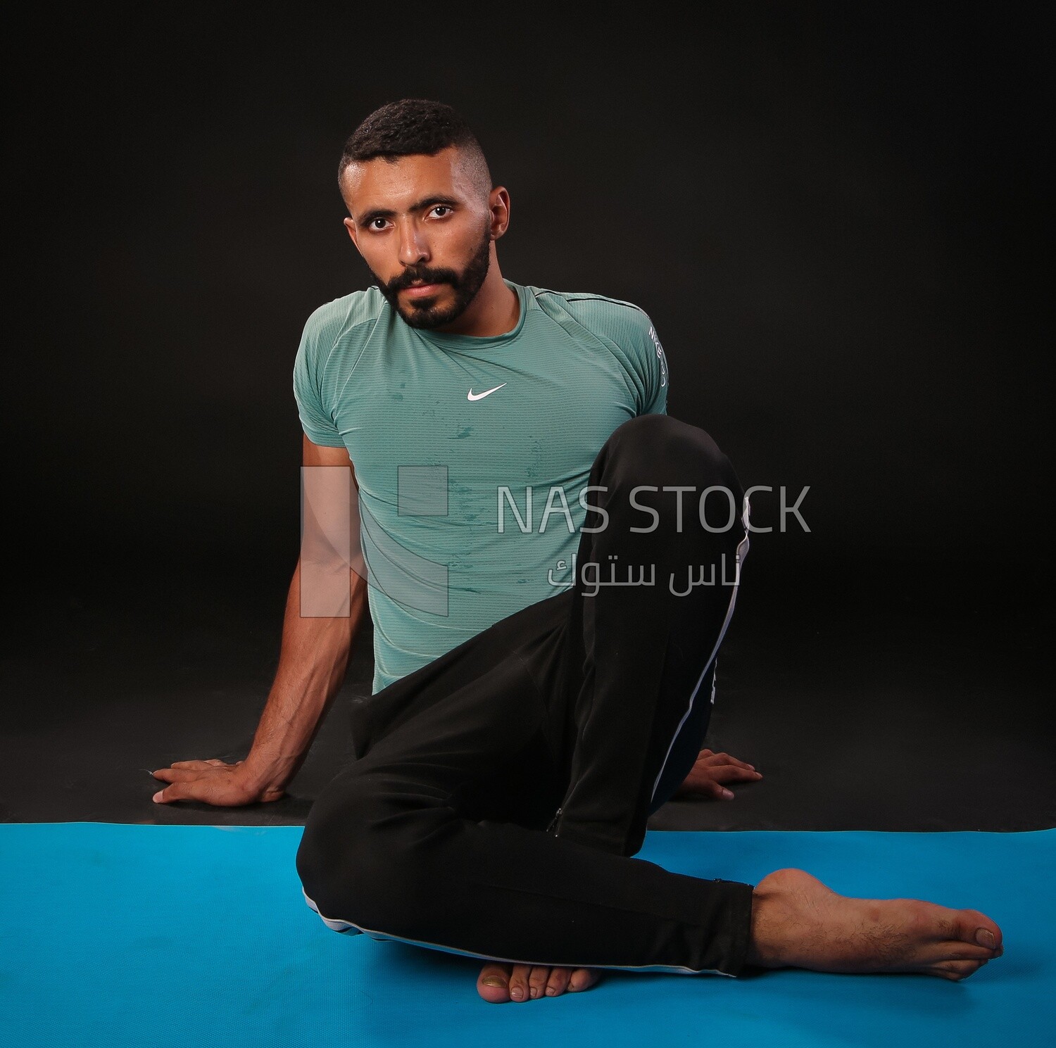 A man training on a black background