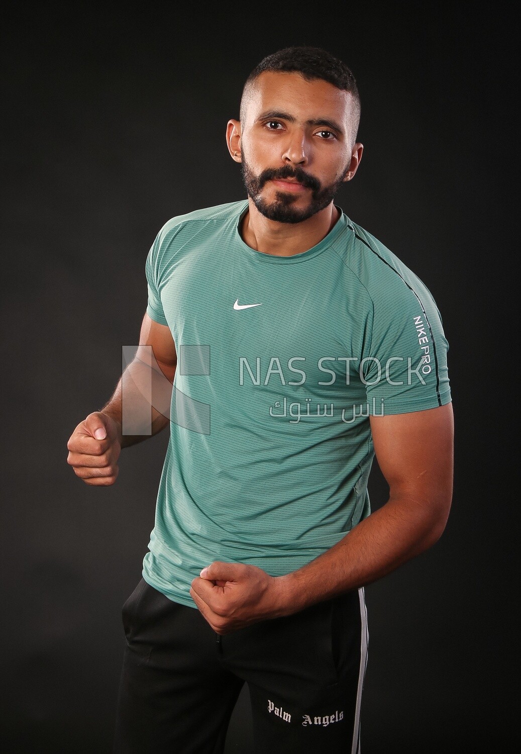 A man training on a black background