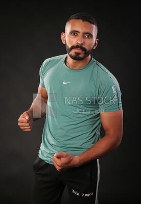A man training on a black background