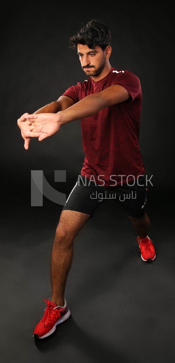 A man training on a black background