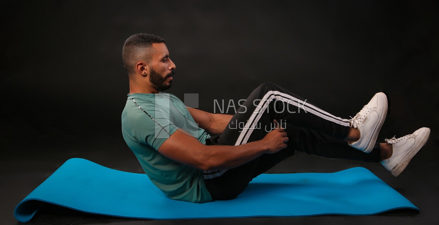 A man training on a black background