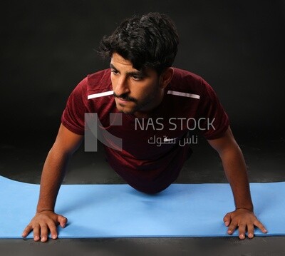 A man training on a black background