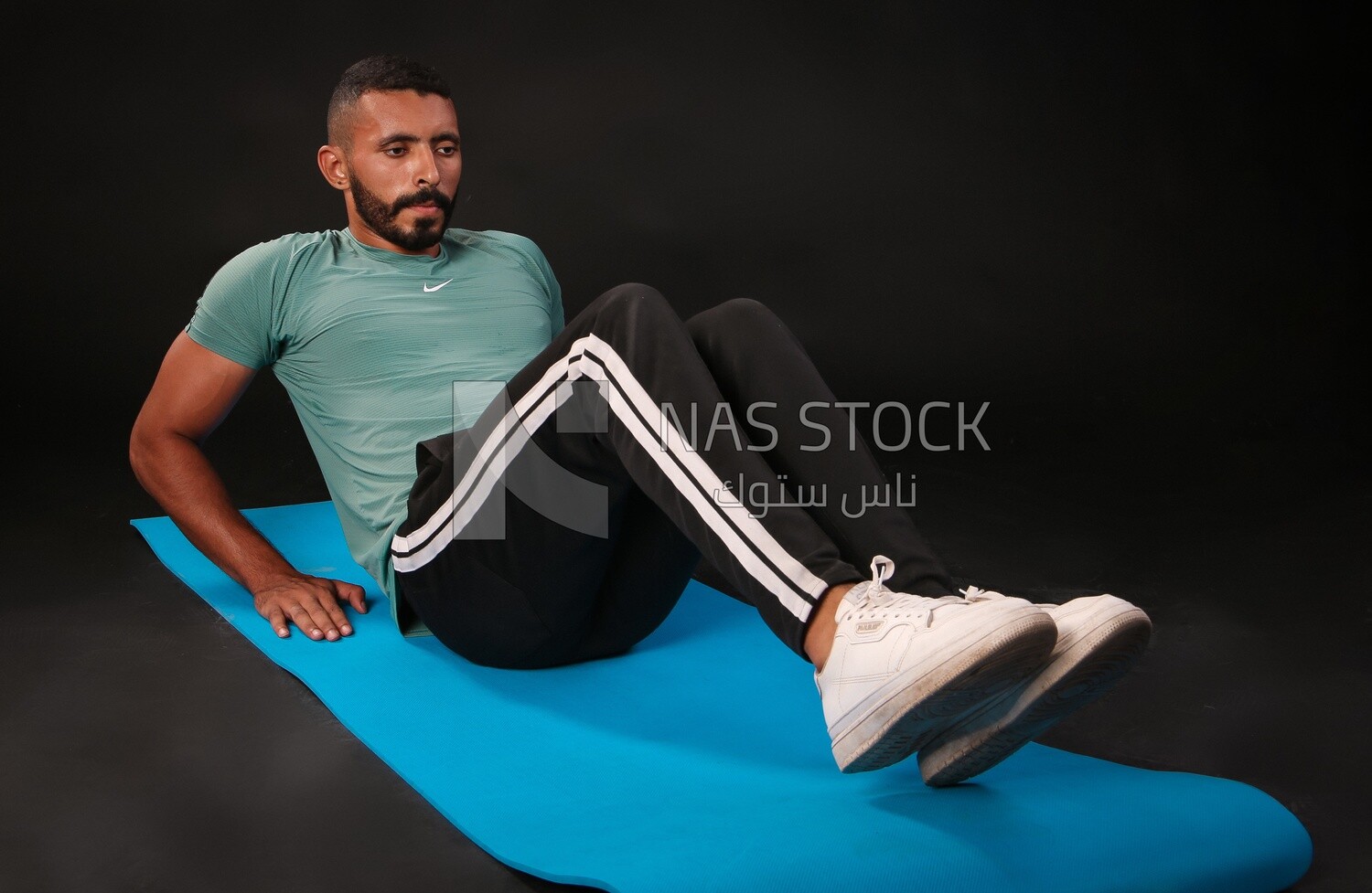 A man training on a black background