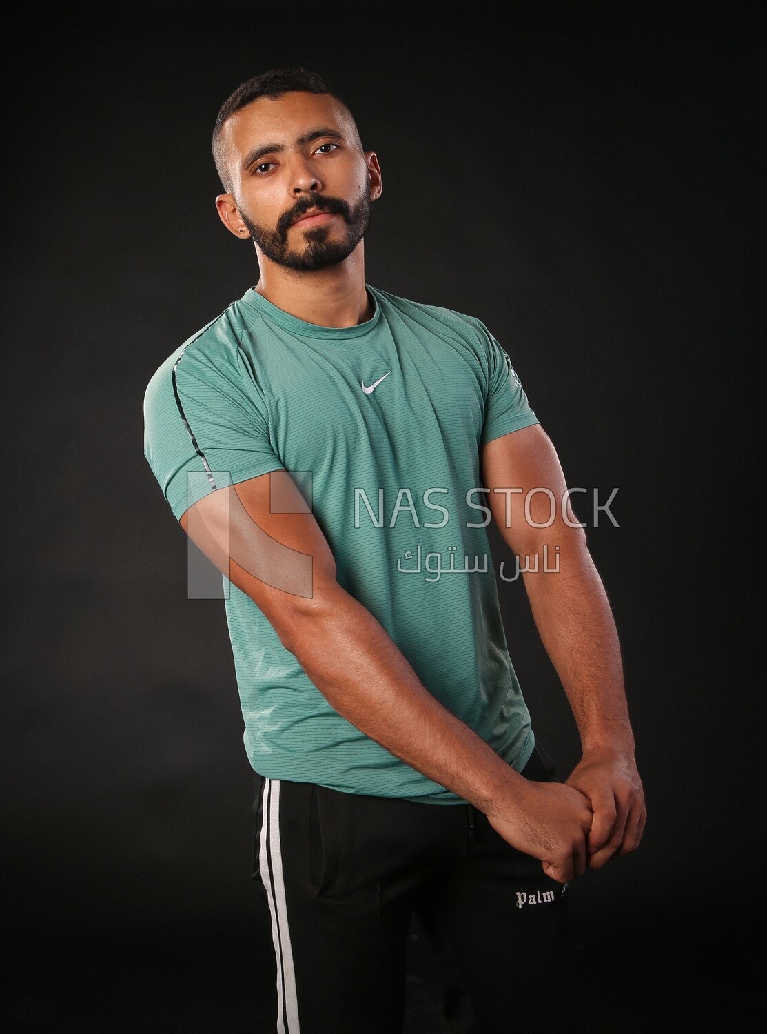A man training on a black background