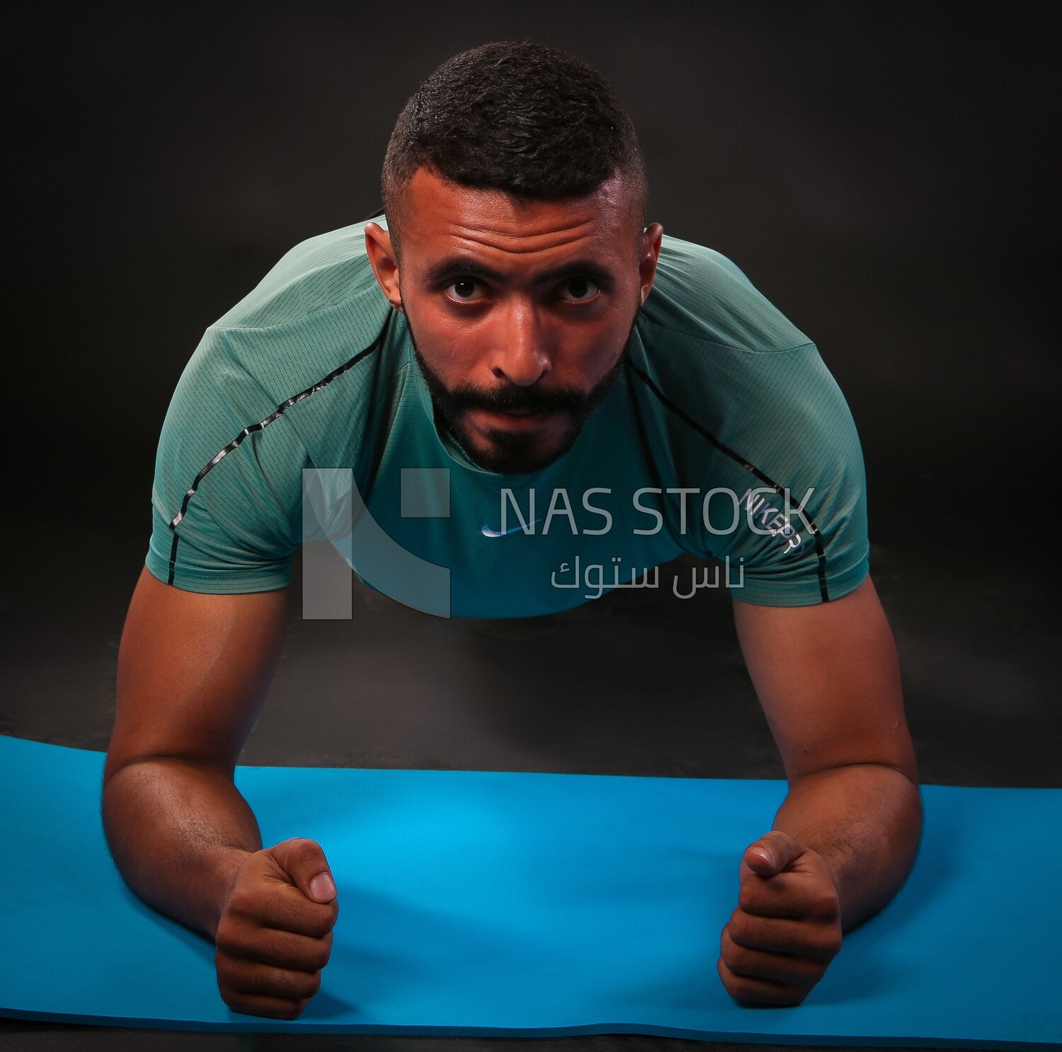 A man training on a black background