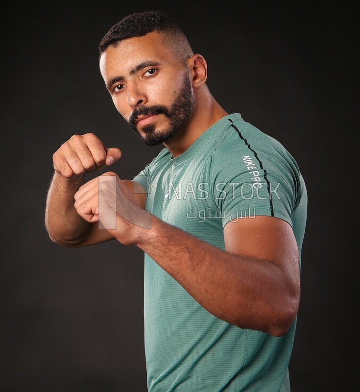 A man training on a black background